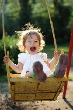 Child on swing Stock-Fotos