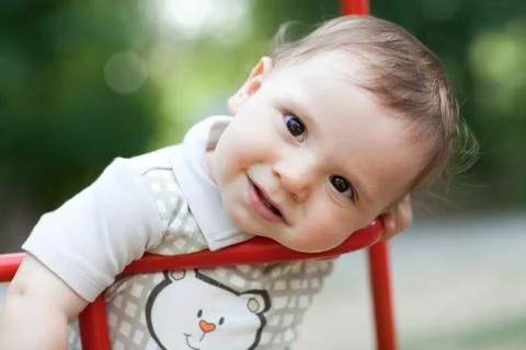 Child on the swing Stock Photos