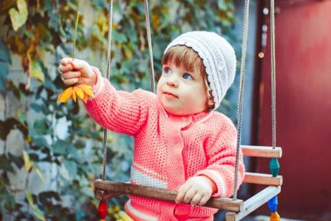 Child on the swing Stock Photos