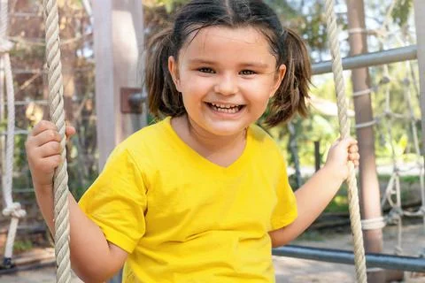 Child on a swing Stock Photos
