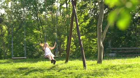 Child on swing in slow motion - dolly shot Video stock 40101188