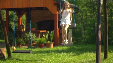 Child on swing in slow motion Stock Footage 40101133