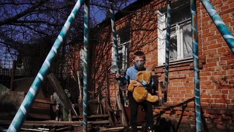 Child on a swing with a toy Video stock 154426959