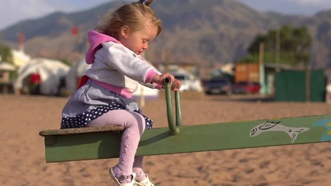 Child swinging on a swing Stock Footage 95270053