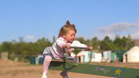 Child swinging on a swing Stock Footage 95270167