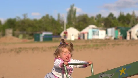 Child swinging on a swing Video stock 97496270