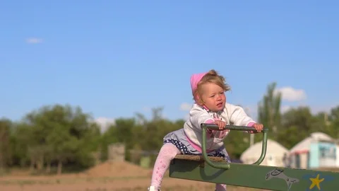 Child swinging on a swing Stock Footage 101010746