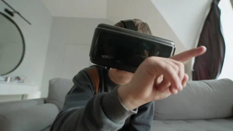 Child Swiping Screen Close Up. Focused boy digital gesture playful indoor Stock Footage 335480765