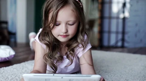 Child with tablet pc. Smiling and looking at camera Stock Footage 64090145