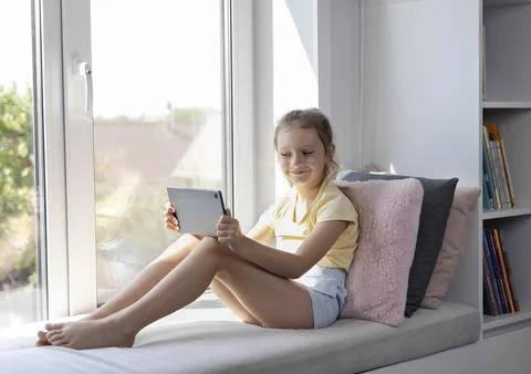 The child with a tablet. The problem of addiction to gadgets Stock Photos