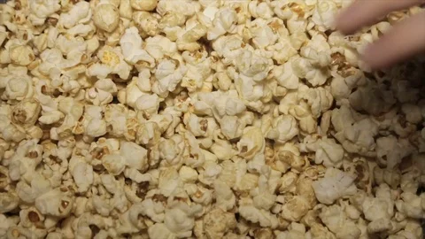 The child takes the popcorn, close-up Stock Footage 72189472