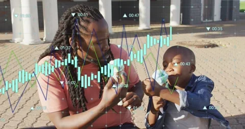Child taking first lick and causing data graph overlay while adult wiping hands, Stock Footage 333904803