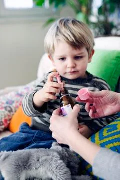 Child taking medication Stock Photos