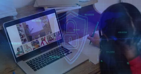 Child taking notes as teacher presenting lesson on laptop with shield icon codes Stock Footage 326193163
