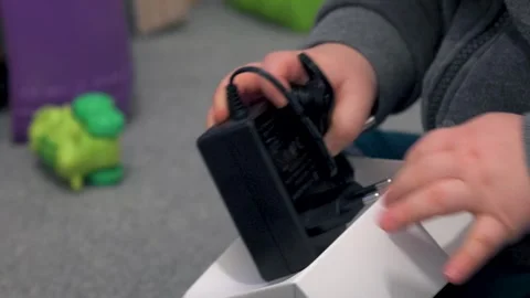 Child Taking Power Adapter Out of Box Stock Footage 325948405