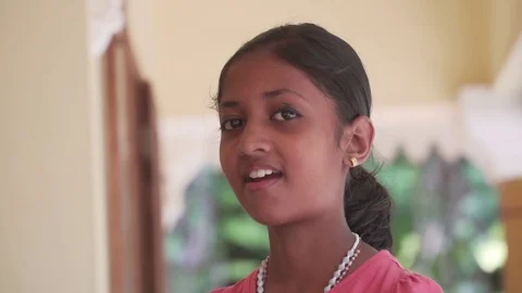Child teases making faces shows the language and faces indian happy happiness Video stock 128502794