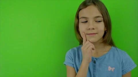 The child thinks on a green background. Selective focus. Stock Footage 169605676