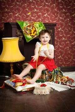 Child, threads, fireplace, lamp Stock Photos