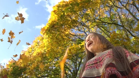 Child throwing fall leaves Stock Footage 88401123