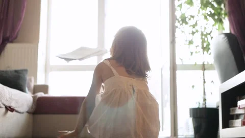 Child throwing papers in the air Video stock 263141069