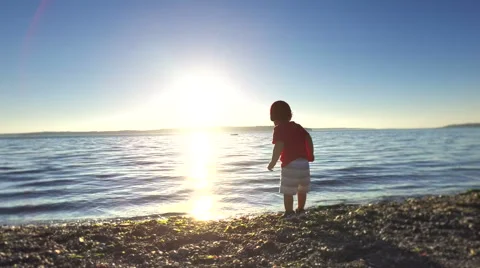Child throwing rocks. Stock Footage 64727282