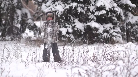 Child throwing snow Stock Footage 44804905