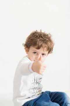 Child with thumb up Stock Photos