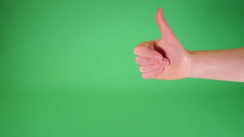 Child thumbs up and thumbs down on Green screen Chromakey pt 1 of 3 Stock Footage 194745121