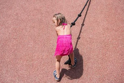 Child on a tightrope Stock Photos