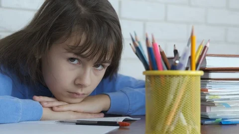 The child is tired of learning. Stock Footage 103175678