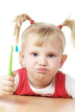 Child with toothbrush in hands Stock Photos