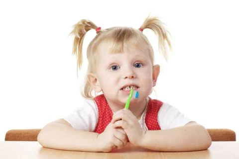 Child with toothbrush in hands Stock Photos