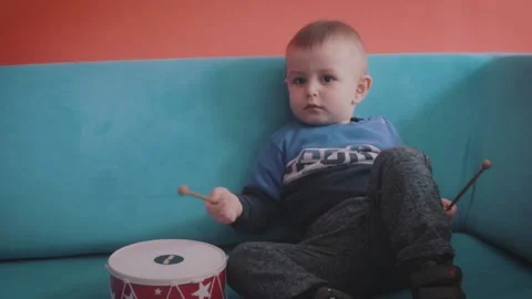 Child With a Toy Drum Set Stock Footage 199660403