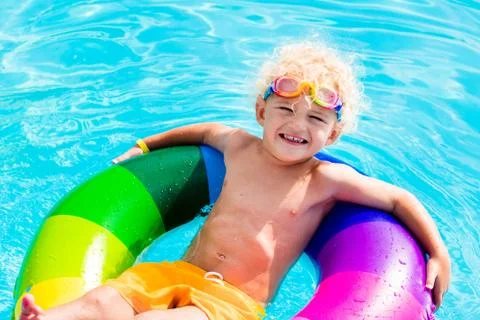 Child with toy ring in swimming pool Stock Photos