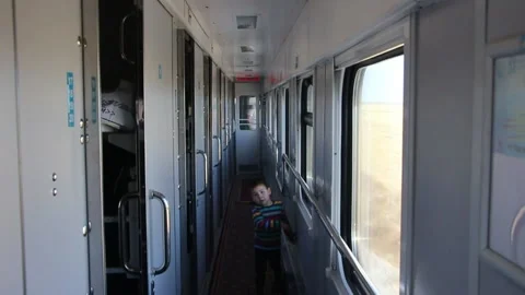 Child in a train corridor walking sleeping car Video stock 145729715