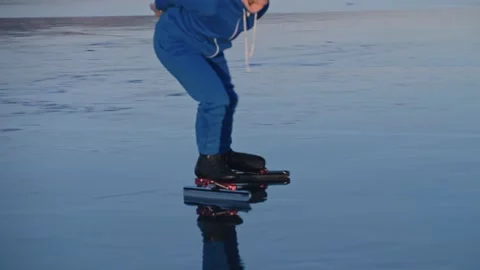 The child train on ice professional speed skating. The girl skates in the winter Stock Footage 155959910
