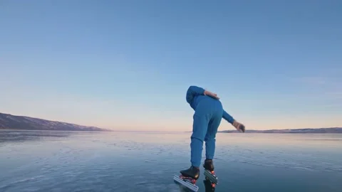 The child train on ice professional speed skating. The girl skates in the winter Stock Footage 168541199