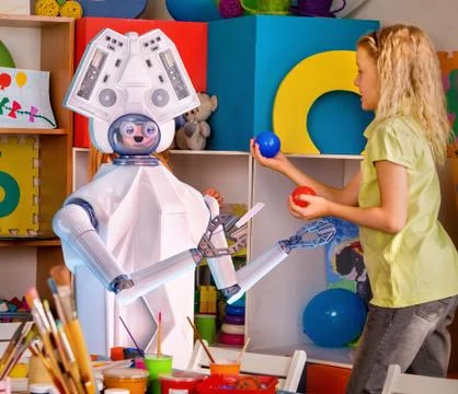 Child training of artificial intelligence by robot. Stock Photos