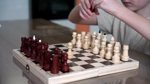 The child trains to play chess, develops his intellect and brain. 스톡 동영상 265762086