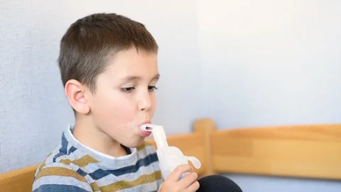 The child is treated with a nebulizer from COVID-19. Stock Footage 128254665