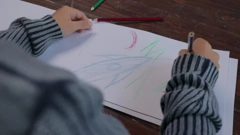 A child tries to draw a space rocket and fails Video stock 286031492