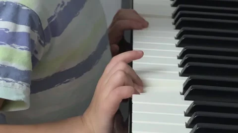 Child Trying Piano Side View, Concept of Musical Persistence Vídeos de archivo 326623782