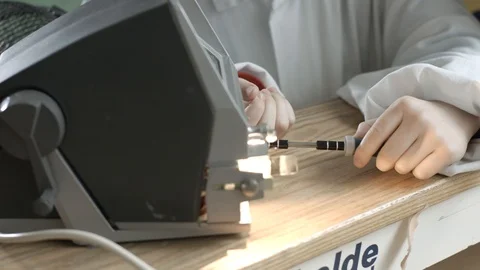 Child Turning Screwdriver Into Mechanical Object Video stock 127180020