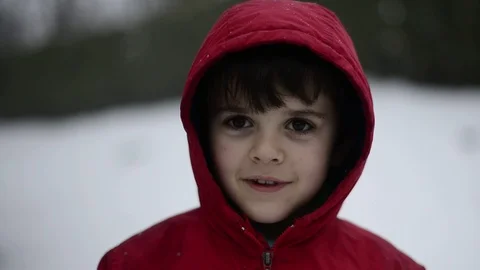 Child under a snowfall Stock Footage 86828355