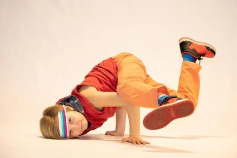 Child in a unique dance pose Stock Photos