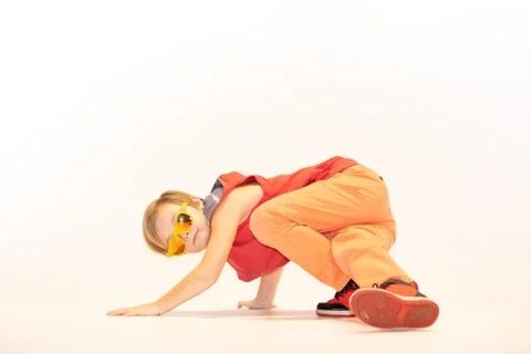 Child in a unique dance pose Stock Photos