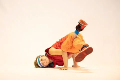 Child in a unique dance pose Stock Photos
