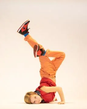 Child in a unique dance pose Stock Photos