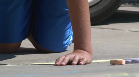 Child uses chalk on cement. Stock Footage 27952741