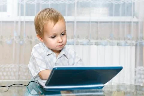 Child uses a children's game computer Stock Photos